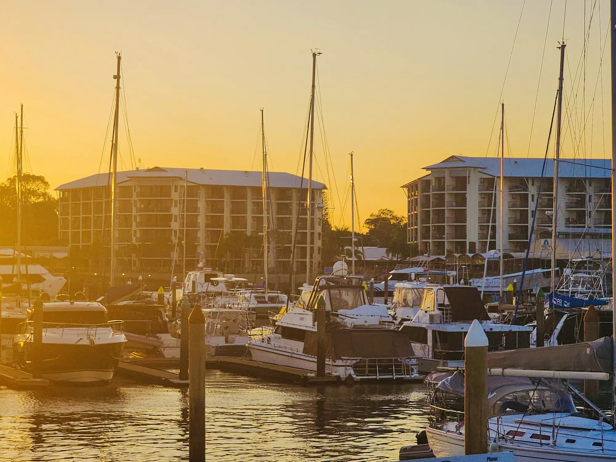 Boats at Urangan Marina in warm sunset light