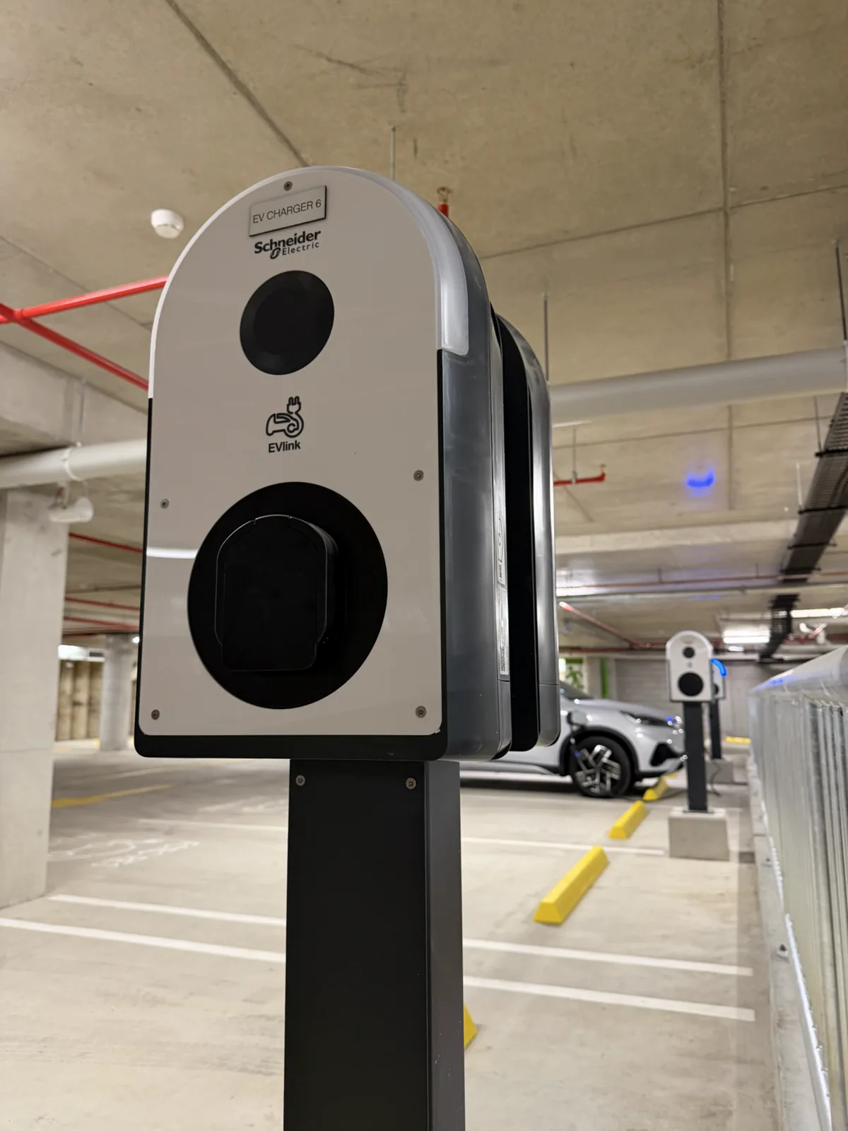 Labelled electric-vehicle charger in the Community Hub basement